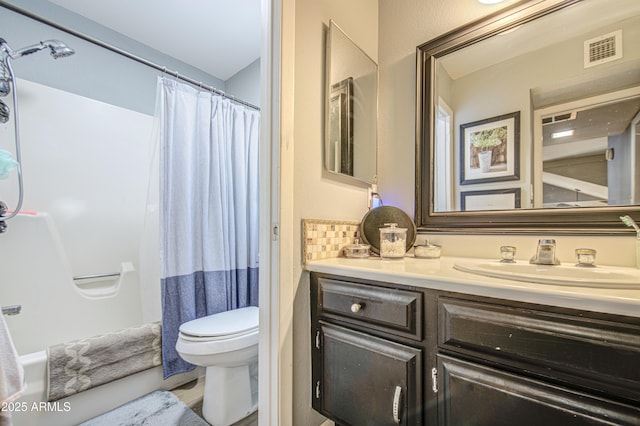 4112 E Maldonado Dr, Phoenix, AZ 85042 - full bath featuring vanity, backsplash, a shower with curtain, toilet, and visible vents