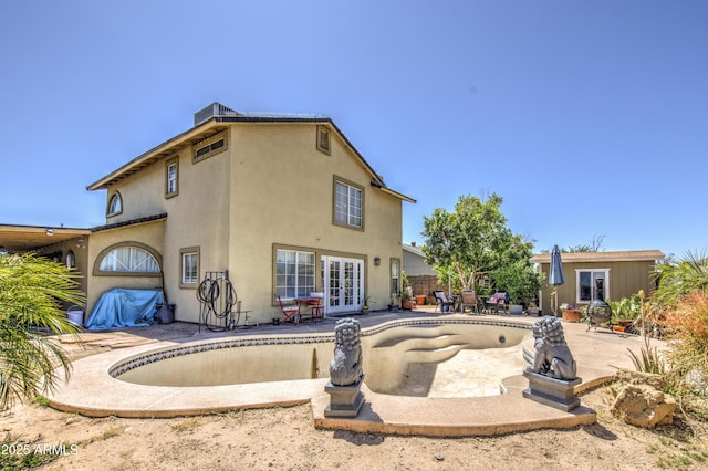 4112 E Maldonado Dr, Phoenix, AZ 85042 - rear view of property featuring french doors, an empty pool, a patio, and stucco siding