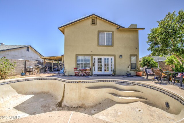 4112 E Maldonado Dr, Phoenix, AZ 85042 - rear view of house featuring french doors, a patio area, and stucco siding