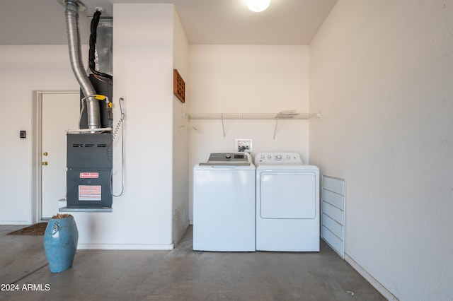 laundry area with washing machine and dryer