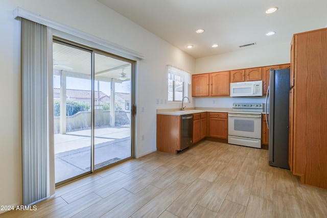 kitchen featuring sink, stainless steel appliances, and light hardwood / wood-style floors