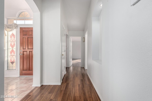 hall with hardwood / wood-style floors