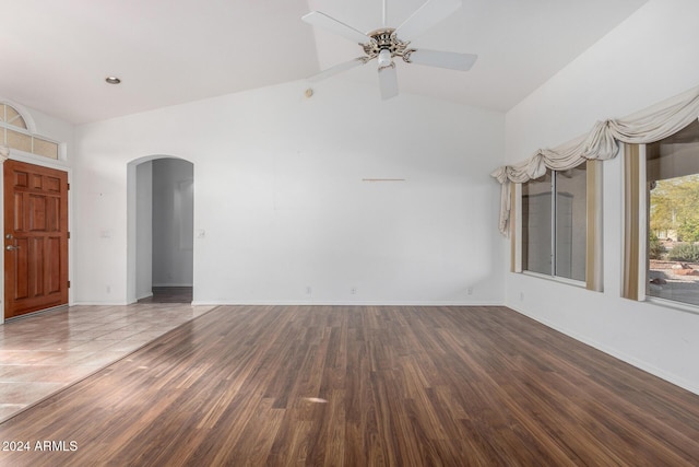 unfurnished room with ceiling fan, hardwood / wood-style floors, and high vaulted ceiling