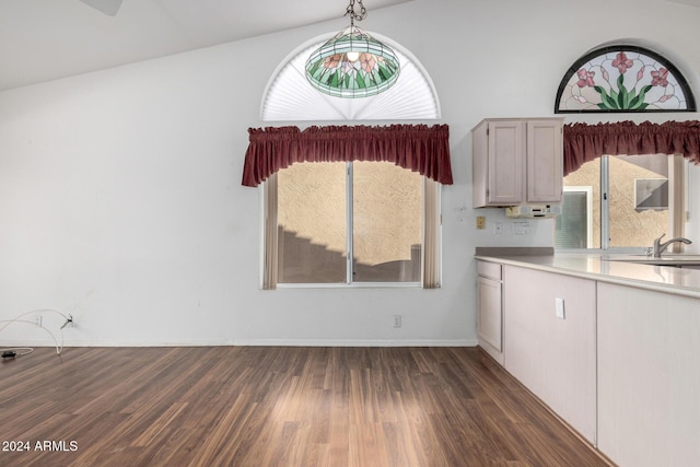 kitchen featuring plenty of natural light, pendant lighting, and lofted ceiling