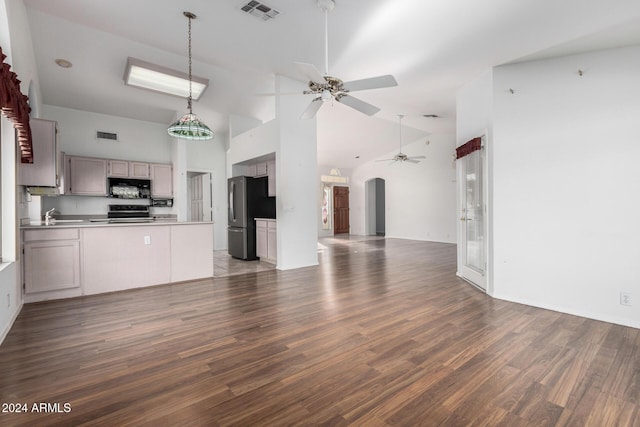 unfurnished living room with ceiling fan, sink, high vaulted ceiling, and dark wood-type flooring