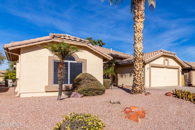 view of front of property with a garage