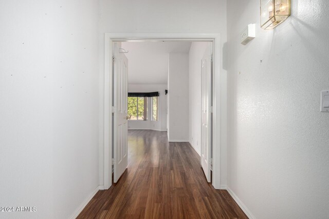 corridor featuring dark wood-type flooring