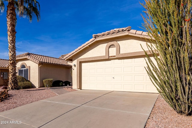 view of front of property with a garage