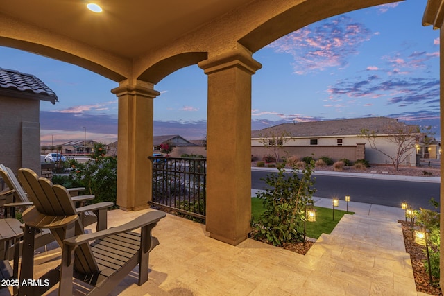 view of patio terrace at dusk