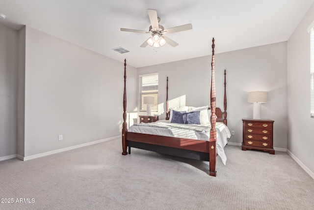 bedroom featuring carpet flooring, visible vents, ceiling fan, and baseboards