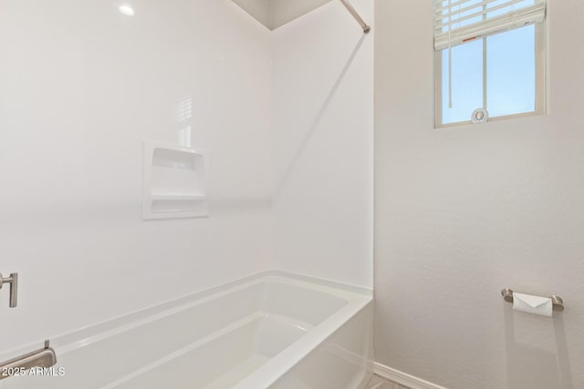 full bathroom featuring baseboards