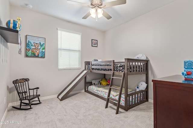 bedroom featuring a ceiling fan, carpet, and baseboards