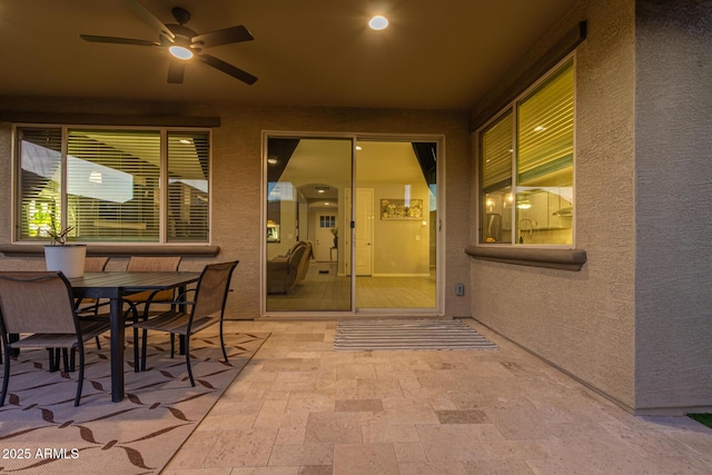 view of patio featuring outdoor dining space and a ceiling fan