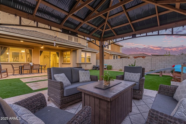 view of patio featuring fence and an outdoor living space