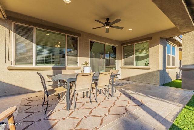 view of patio / terrace with a ceiling fan and outdoor dining area