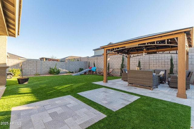 view of yard with a patio area, a fenced backyard, an outdoor living space, and a gazebo