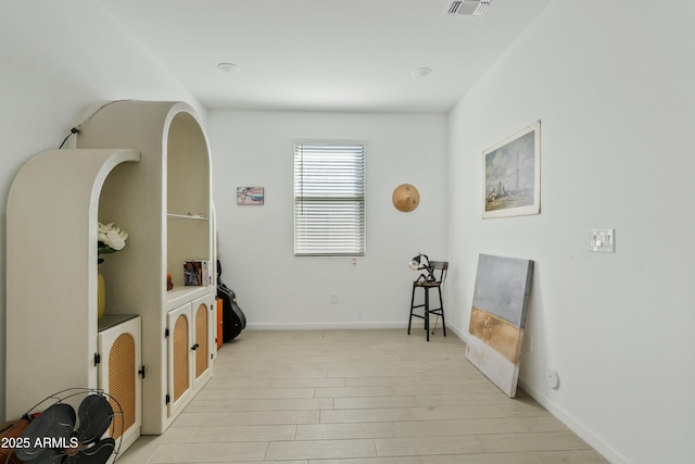 sitting room with light hardwood / wood-style flooring