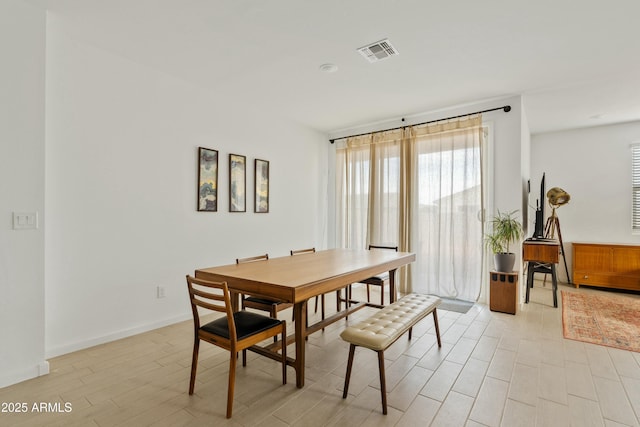 dining room with light hardwood / wood-style floors