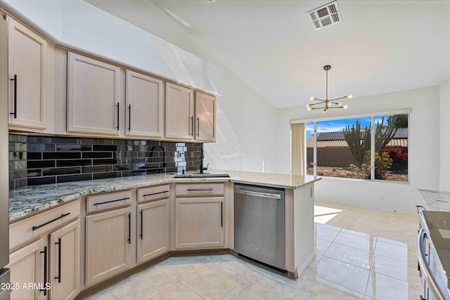 kitchen featuring tasteful backsplash, visible vents, dishwasher, light tile patterned floors, and a peninsula