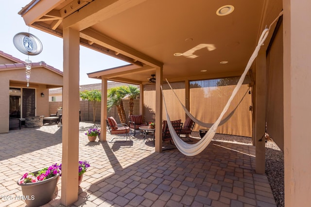 view of patio featuring ceiling fan