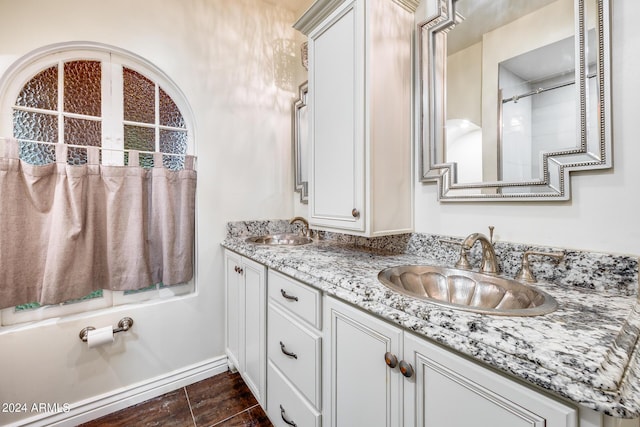 bathroom featuring tile patterned flooring and vanity