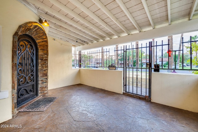 entryway featuring plenty of natural light and beam ceiling