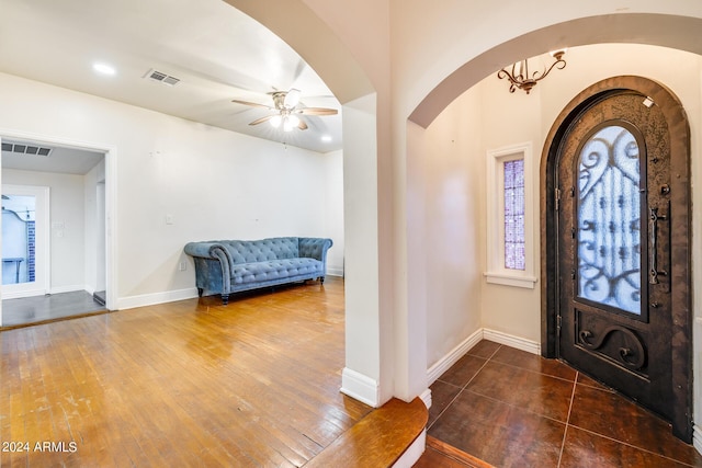 foyer featuring ceiling fan and dark wood-type flooring