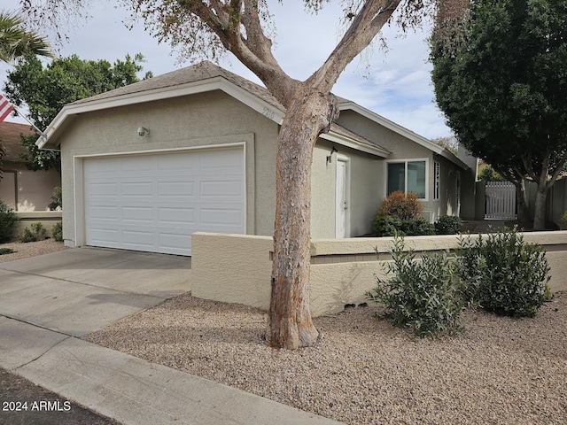 single story home featuring a garage