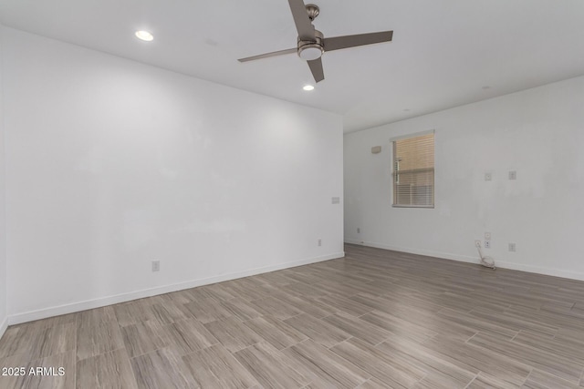 empty room with light wood-style floors, recessed lighting, ceiling fan, and baseboards