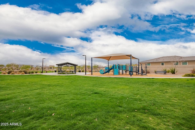 communal playground with a yard, a gazebo, and fence