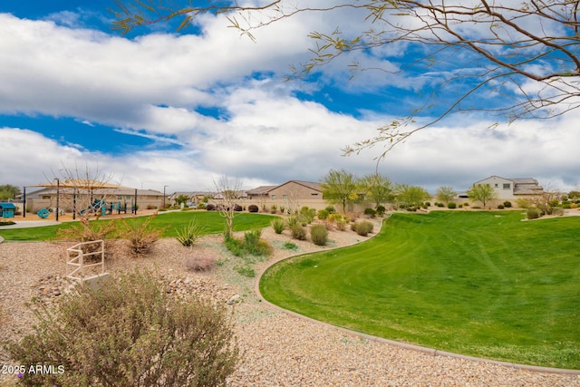 view of property's community with a lawn