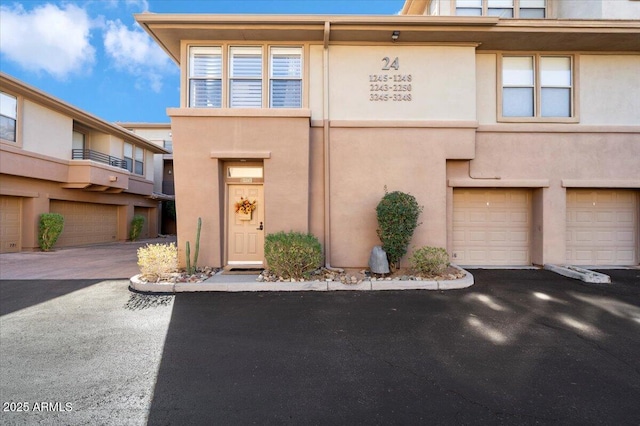 19777 N 76th St N Unit 2243, Scottsdale, AZ 85255 - view of property featuring a garage and stucco siding