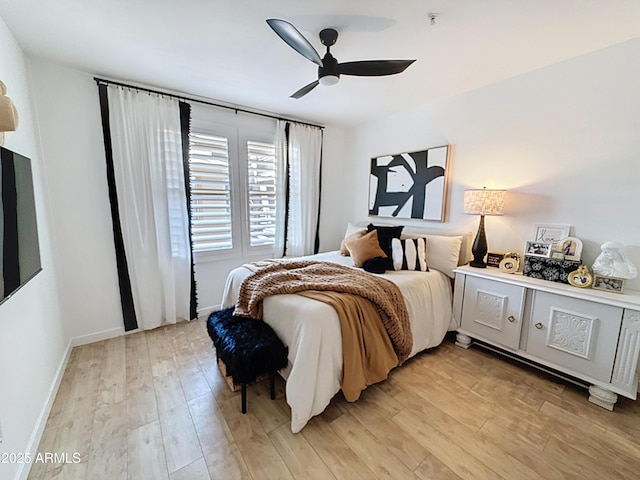 19777 N 76th St N Unit 2243, Scottsdale, AZ 85255 - bedroom with light wood-style flooring, ceiling fan, and baseboards
