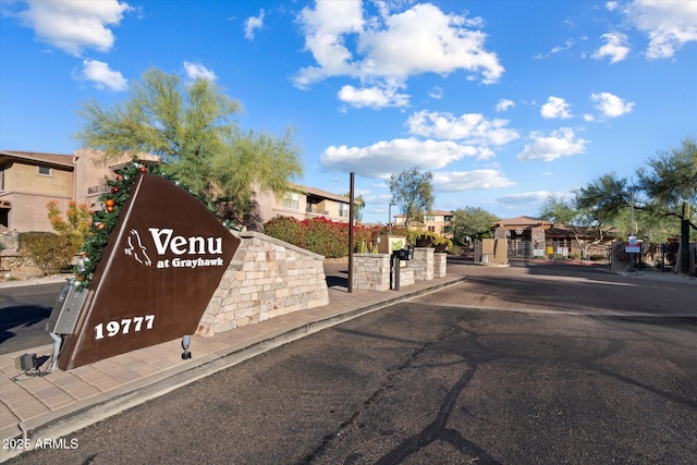 19777 N 76th St N Unit 2243, Scottsdale, AZ 85255 - view of asphalt street featuring curbs, a gated entry, and a residential view