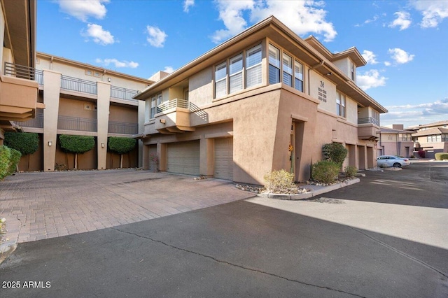 19777 N 76th St N Unit 2243, Scottsdale, AZ 85255 - view of property with a garage, driveway, and a residential view