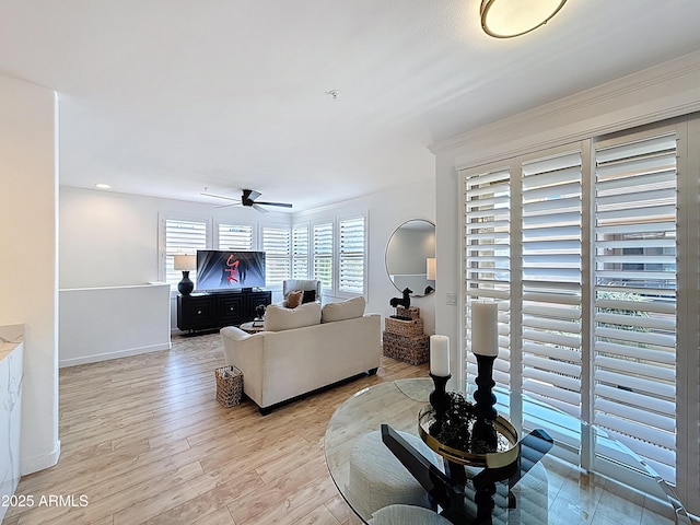 19777 N 76th St N Unit 2243, Scottsdale, AZ 85255 - living room with ceiling fan, light wood-style floors, and baseboards