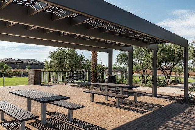 view of home's community featuring a patio and fence