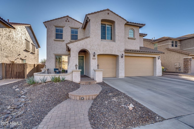 mediterranean / spanish-style home featuring a garage