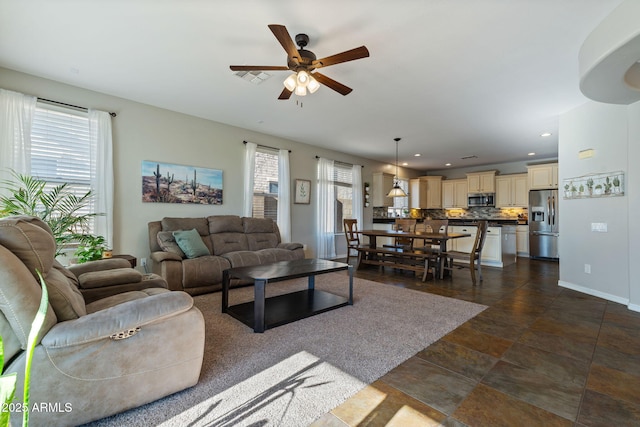 living room with ceiling fan