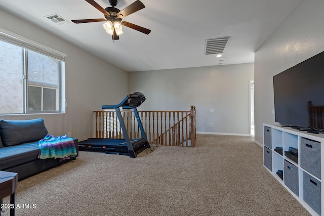 workout room featuring light colored carpet and ceiling fan