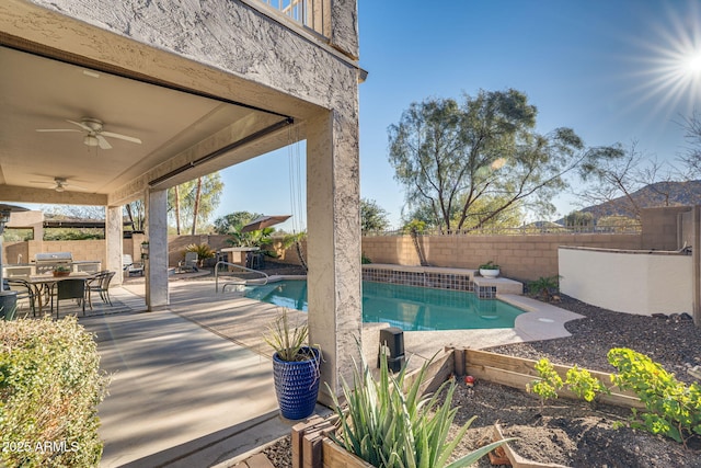 view of pool with a patio area, grilling area, and ceiling fan