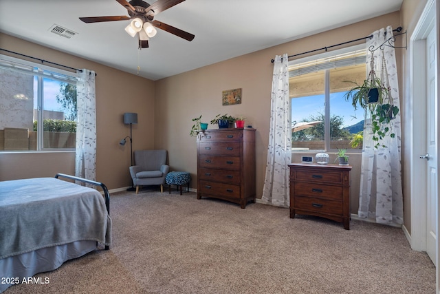 bedroom featuring light carpet and ceiling fan