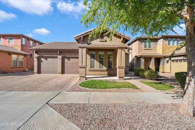 3836 E Geronimo St, Gilbert, AZ 85295 - view of front facade featuring a tile roof, decorative driveway, an attached garage, and stucco siding