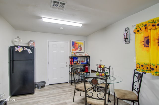 dining room with light hardwood / wood-style floors