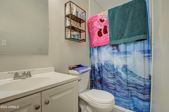 bathroom with vanity, toilet, and a shower with curtain