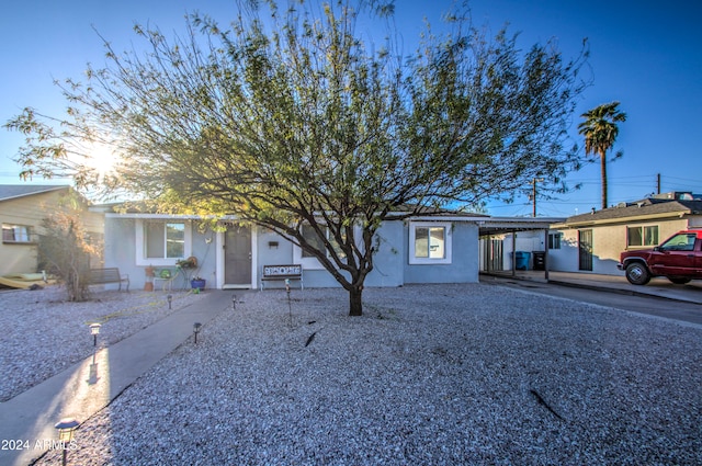 single story home with a carport