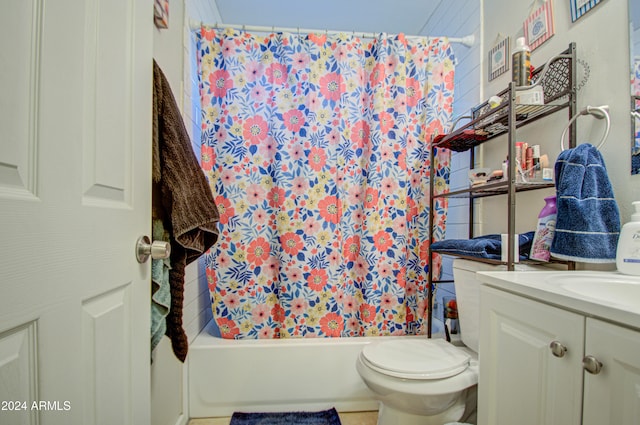 full bathroom with shower / tub combo with curtain, vanity, and toilet