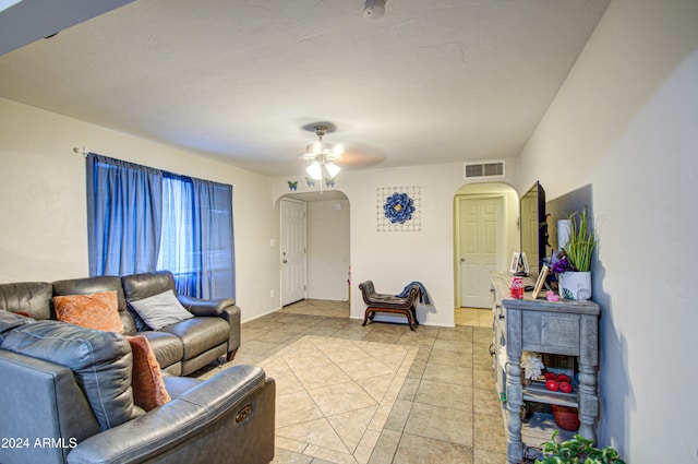 living room featuring ceiling fan and light tile patterned floors