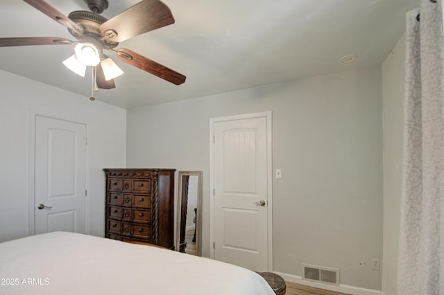 bedroom with hardwood / wood-style flooring and ceiling fan