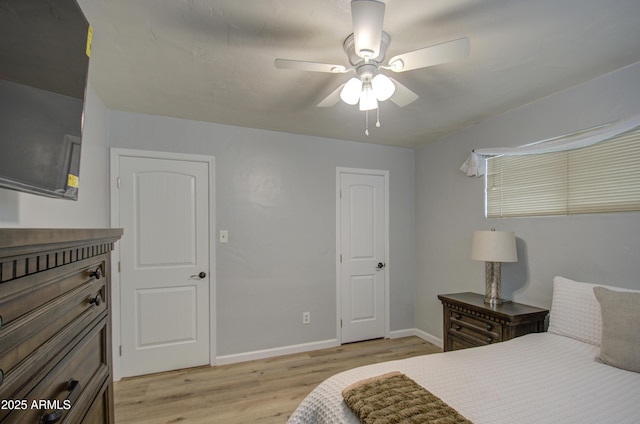 bedroom featuring ceiling fan and light hardwood / wood-style flooring